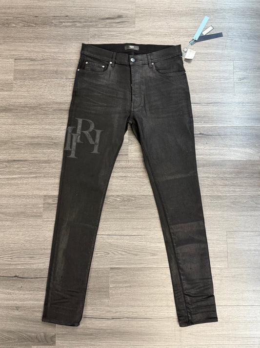Amiri Staggered Skinny Jeans "Leather Logo Black"